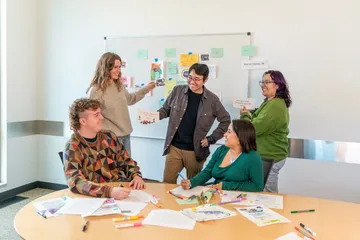 CSUMB environmental science students share and discuss project ideas during an interactive classroom activity.