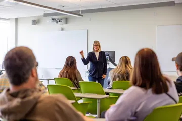 Teacher in front of classroom of students