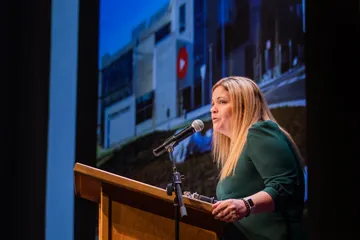 President Vanya Quiñones giving a speech