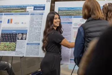 A student giving their capstone presentation