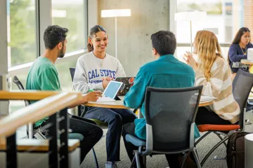Four students studying at table