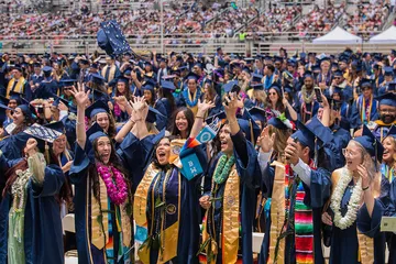 Graduates celebrate together at commencement, capturing joy, achievement and a strong sense of community.