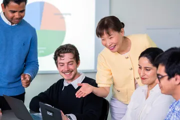 An accounting professor overlooks a classroom of accounting students