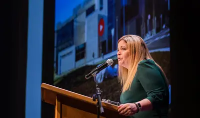 President Vanya Quiñones giving a speech