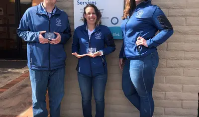 Intern cohorts (from left) Daniel Reed and Mallorey Gatti, with Amy Miller.
