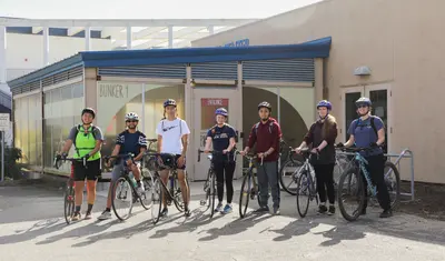 7 students ready to go on a coastal bike ride