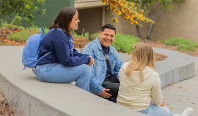 Students chatting together outside