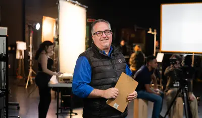 A man is smiling for a pic