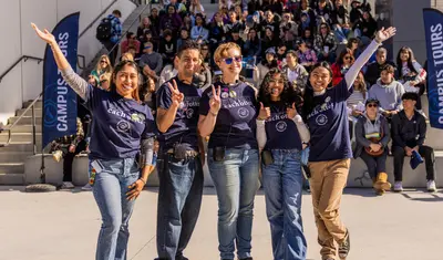 People posing for photo at event