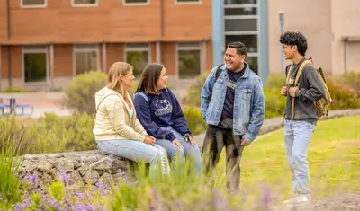 Students chatting outside on campus