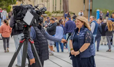 Vanya Quinones being Interviewed at the Otter Statue Unveiling