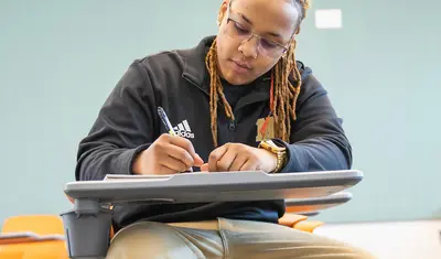 A student sitting in a desk