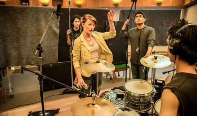 A group of people preparing for music