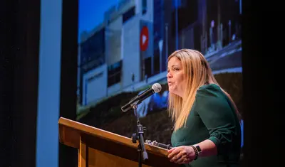 President Vanya Quiñones giving a speech