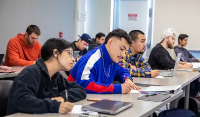 Students in class writing