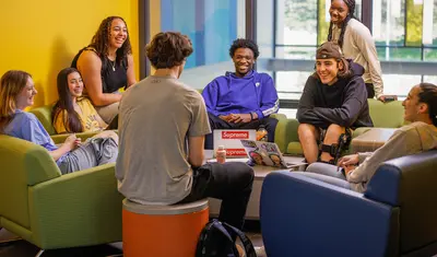 Students sitting in the lounge conversing