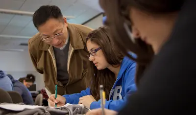 a professor helping a student