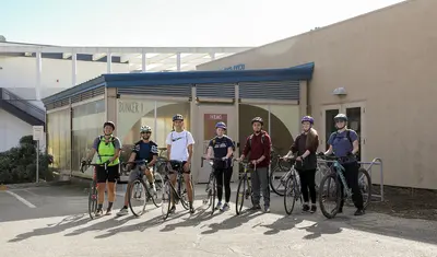 7 students ready to go on a coastal bike ride
