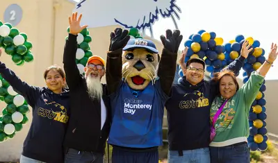 Admitted otter day 2025, new students and parents with Monte celebrating