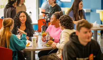 Students sitting at a dining table
