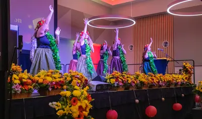 Hula dancers onstage at the APIDA Stole Ceremony