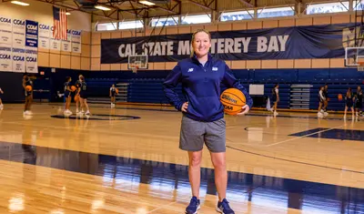 Woman's basketball coach in the gym