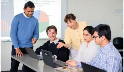 An accounting professor engages with students