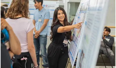 A girl is smiling for a photo