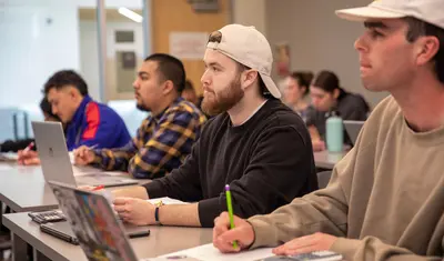 College of Business students listening at class