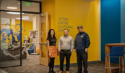 Faculty members standing in front of the OC3