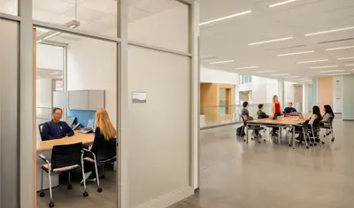 A photo of the BIT building with students and professors in the background