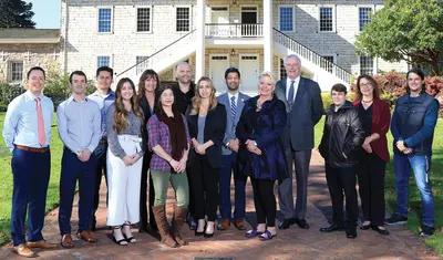 CSUMB alumni who are city of Monterey employees outside Colton Hall Museum with City Manager Hans Uslar (fourth from right). From left: Jay Punkar, Eric Palmer, Rafael Albarran, Kristonee Wade, Gundy Rettke, Jennifer Cleary, Ben Fowler, Paige Smith, Nat Rojanasathira, Wendy Davies, (Uslar), Vince Pizzo, Olga Maximoff and Jordan Leininger.