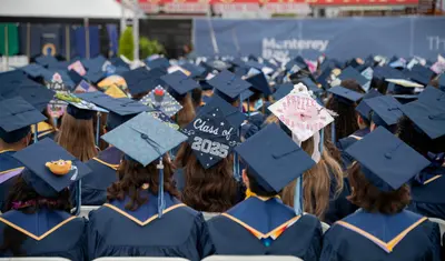2025 CSUMB Grads sitting at the Commencement ceremony