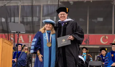 President Quiñones with Honorary degree recipient David L. Stivers at Commencement