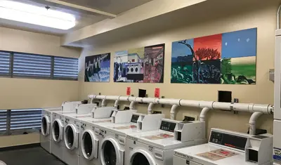 Washing machines at Pinnacles building outfitted with gray water diversion pipes