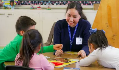 A CSUMB student tutoring kids.