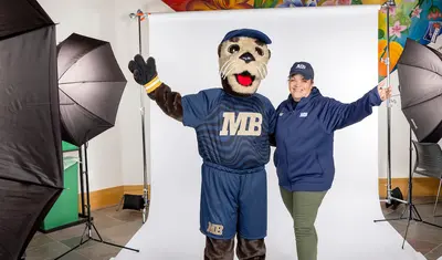 President Quinones posing with Monte Rey