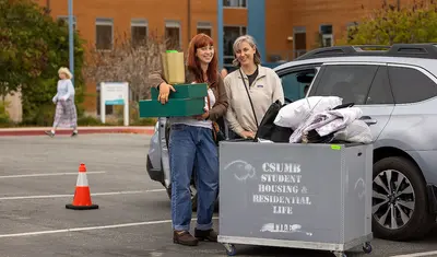 A student and their mom at Move-In Day 2023 - by Brent Dundore-Arias