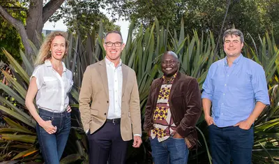 Interim Provost Andrew Lawson (second from left) with faculty members (from left) Lindsey Brammell, Jeremias Zunguze and Caetano Albuquerque. Jacqui Smith is not pictured. | Photo by Brent Dundore-Arias