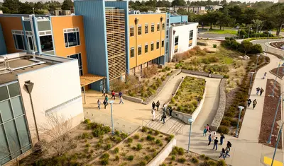 Aerial drone photo of students walking on the Cal State Monterey Bay campus.