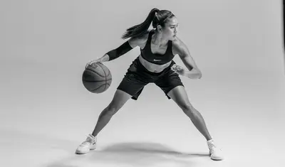 Photo: Stefanie Corgel posing in Nike gear with a basketball