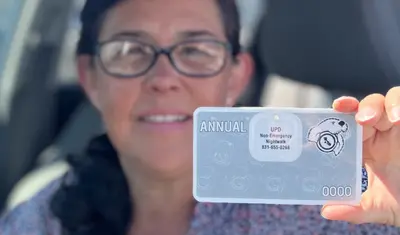 women holding a parking permit