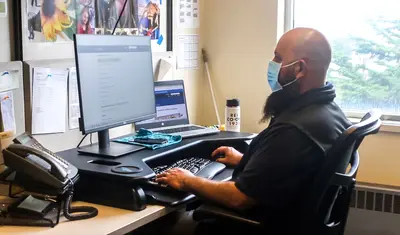 Bobby Quinonez working at his desk