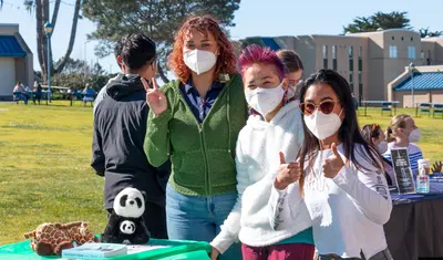 Students masked at the Otter Showcase on campus