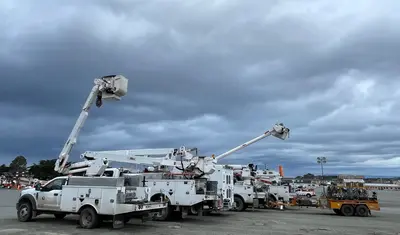 Bucket lift trucks on a CSUMB lot