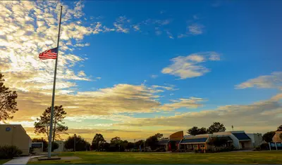 Photo: American flag at half mast in quad