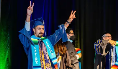 A Latinx student crosses the state at the stole ceremony