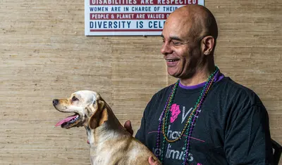 Photo: Steven Goings holding a dog