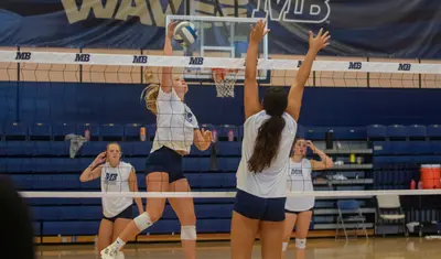 Volleyball players in 2022 practice