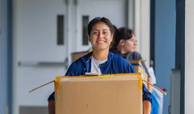 A student moving in to campus housing | By Brent Dundore-Arias